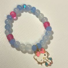 Hello Kitty Charm Bracelet With Pink And Baby Blue Beads For The Fashionista In You Trendy Blue Beaded Bracelets For Birthday, Cute Blue Charm Bracelet For Gift, Pink Kawaii Jewelry With Colorful Beads, Cute Blue Bracelet Jewelry, Cute Blue Bracelet For Birthday, Cute Blue Jewelry With Colorful Beads, Handmade Blue Kawaii Jewelry, Cute Blue Beaded Bracelets For Birthday, Cute Hypoallergenic Blue Beaded Bracelets