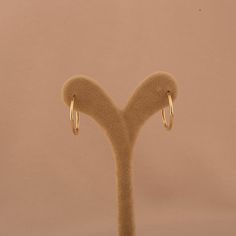 Our 14K Gold Skinny Hoop Earrings offer a timeless design, combining sleek elegance with everyday functionality. These classic hoops are crafted from genuine 14K solid gold, providing durability and a lasting shine that will complement any wardrobe. With an outside diameter of 21.5mm and an inside diameter of 19mm, these earrings are designed to be lightweight and comfortable, making them perfect for daily wear or special occasions. The slender thickness of 1.65mm ensures they remain subtle yet noticeable. Key Features: Sleek Design: Features a slender profile, perfect for adding a touch of elegance to any outfit. High-Quality Material: Crafted from genuine 14K solid gold, ensuring both elegance and long-lasting wear. Lightweight Comfort: Designed with a thickness of 1.65mm for a comfortab Gold Heart Ring, Love Ring, Exquisite Jewelry, Heart Bracelet, Heart Of Gold, Charm Jewelry, Chain Bracelet, Gold Chains, Sleek Design