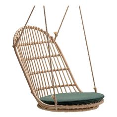 a hanging chair with a cushion on the front and back end, made out of wicker