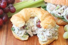 a croissant filled with chicken salad and grapes