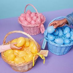 an egg hunt with eggs in baskets and someone placing them into the basket to put them in