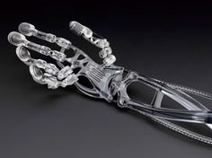 a robotic hand is shown on a black surface