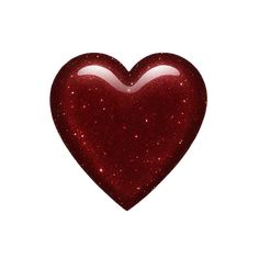 a red heart shaped object with glitter on it's surface, against a white background