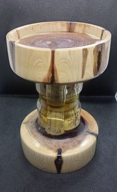 a wooden bowl sitting on top of a table