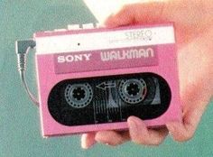 a person holding a pink cassette player in their hand with the words sony walkman on it