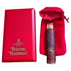 "Vivienne Westwood” Mac Check Black Enamel Lighter Orb logo Red hot lipstick top, British Punk/Rock Westwood has carried her rebellious spirit into her collections throughout her career, often combining punk symbolism with traditional feminine themes, and she's now considered one of the greatest architects of British style. This Westwood vintage lighter from the 80s embodies exactly that. It is in mint condition Needs gas Comes in original box and paper This Westwood lighter was sold in Japan during the 80s New and unused. It has been sleeping at home for many years. Cool Lighter Designs, Vivienne Westwood Lighter, Pretty Lighters, Vivienne Westwood Vintage, Hot Red Lipstick, Goth Wardrobe, Feminine Theme, Westwood Vivienne, Everyday Bag Essentials