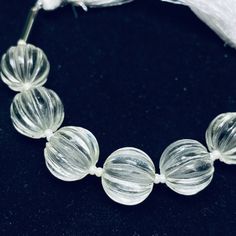 This listing is for 100% Natural Crystal Quartz Carved Melon Shape Beads Strand, Melon Shape Gemstone, Gemstone for Jewlery, 12 mm.   100% Natural Crystal Quartz Carved Melon Shape Beads Strand, Melon Shape Gemstone, Gemstone for Jewlery, 12 mm.  Size: 12 mm  (Measurement are close to approximations.) Product:  Beads Strand  Type Of stone-:  Crystal Quartz Shape: Melon Style: Carved 100% Genuine & Natural Important Information : * Express Shipping available for extra charge. * Free Custom Drilli Elegant 8mm Round Beads For Gems And Cabochons, Elegant 8mm Round Beads For Jewelry Making, Elegant Round Gemstone Beads, Adjustable Clear Round Bead Crystals, Handmade Clear Beaded Round Bracelets, Clear Faceted Round Beads Bracelet, Silver Crystals With Gemstone Beads, Elegant Round Faceted Beads, Gems, And Cabochons, Elegant Round Faceted Beads Gems And Cabochons