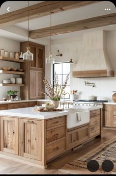 a large kitchen with wooden cabinets and white counter tops, along with an area rug on the floor