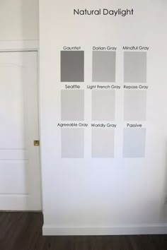 a white wall with several shades of gray on it and the words natural daylight above them