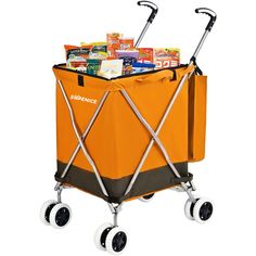 an orange and black cooler with wheels on the bottom is full of books, magazines, and snacks