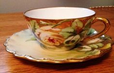 a cup and saucer on a wooden table