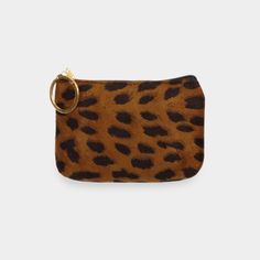 a leopard print purse with a gold ring