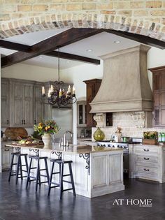 a large kitchen with an island and lots of counter space