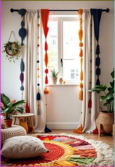 a living room filled with lots of colorful curtains and rugs next to a window