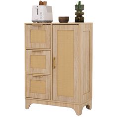 a wooden cabinet with wicker doors and drawers next to a potted plant on top