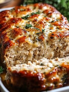 meatloaf with cheese and herbs in a casserole dish