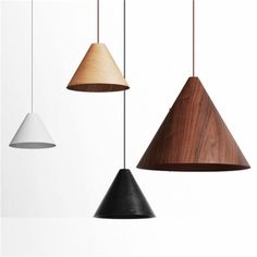 three wooden and white lamps hanging from the ceiling, one is black, one is brown