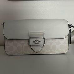 White Shoulder Bag And Matching Wallet From Coach. Only Used Twice. In Almost New Condition. Beautiful Bag In Style! Comes With Extra Strap So It Can Be Worn As A Crossbody. Luxury White Flap Bag With Removable Pouch, White Handheld Flap Bag For Everyday, Designer White Clutch With Top Handle, Designer White Shoulder Bag Clutch, Designer White Top Handle Clutch, White Designer Top Handle Clutch, White Leather Clutch With Detachable Strap, Luxury White Shoulder Bag Clutch, White Rectangular Shoulder Bag With Magnetic Closure