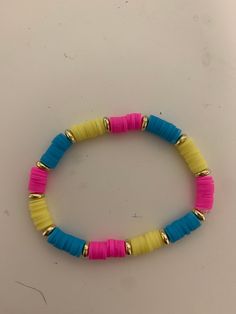 This bracelet has 10 pink beads, then a golden bead, it has 10 pink beads then a golden bead after that. It has 10 blue beads then a golden bead to. It's very cute and you can wear it anywhere!! Bracelet Stuff, Preppy Bracelets, Yellow And Pink, Bead Bracelets, Pink Beads, Bracelet Crafts, Pink And Yellow, Pink Bracelet, Blue Beads