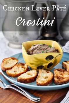 chicken liver pate crostini with olives in a bowl on a blue plate