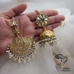 Gold plated, pure thapa kundan set. Jhumkis are very lightweight, tikka is handcrafted. Jhumkis length 2.7 inches approx. Wedding Brass Chandbalis With Tilla Detailing, Wedding Brass Chandbalis With Tilla, Wedding Chandbalis In Brass With Tilla Detail, Wedding Chandbalis With Tilla In Brass, Wedding Brass Jhumkas With Tilla Detail, Gold Kundan Jhumkas For Diwali, Gold Plated Chandbali Tikka, Gold Kundan Danglers With Tilla, Gold Chandbali Tikka, Gold Plated