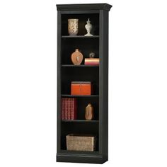 a black bookcase with four shelves and baskets on the bottom shelf, in front of a white background