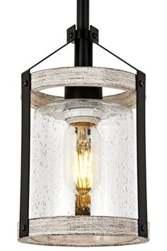 a light fixture with a glass and metal cage on the top, hanging from an iron rod