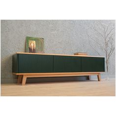 the sideboard is made out of wood and has a magazine on it