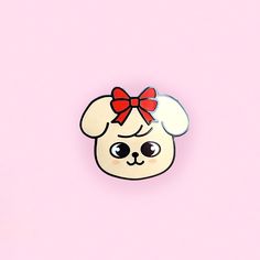 a white dog with a red bow on it's head is standing in front of a pink background