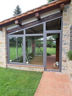 an open patio with sliding glass doors on the outside