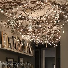 a room filled with lots of lights hanging from the ceiling