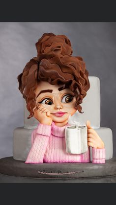 a close up of a cake with a doll holding a cup