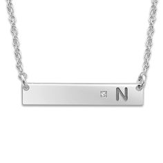 Create a meaningful gift or a cherished keepsake and inscribe your favorite initial onto this sleek women's bar pendant necklace, punctuated with a brilliant diamond accent. Fashioned in white gold-plated sterling silver, the 18-inch rope chain secures in place with a spring ring clasp. Free personalization! Please provide one initial for this item if you wish to personalize it. Elegant Silver Nameplate Birthstone Necklace, Silver Initial Necklace With Rectangular Pendant For Anniversary, Silver Rectangular Pendant Initial Necklace For Anniversary, Classic Silver Bar Necklace For Anniversary, Silver Name Necklace With Rectangular Pendant For Anniversary, Elegant Personalized Silver Bar Necklace, Classic Bar Necklace With Diamond Accents For Gifts, Silver Bar Necklace For Anniversary, Elegant Silver Nameplate Bar Necklace