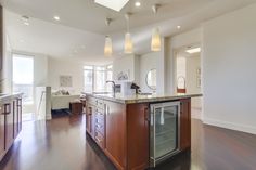 a large kitchen with an island in the middle