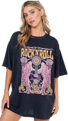 Our "Rock and Roll Tee" is a black t-shirt that that says "rock and roll" in yellow on the front. It has a guitar design on it. These are an oversized fit. Trendy Band Logo T-shirt For Concerts, Black Cotton Rock And Roll T-shirt, Rock And Roll Short Sleeve T-shirt For Concert, Rock Style Crew Neck T-shirt For Music Festival, Trendy Band Logo T-shirt In Relaxed Fit, Graphic Print Tops For Music Festivals And Concerts, Trendy Relaxed Fit T-shirt With Band Logo, Casual Black Tops For Music Festivals, Casual Black Top For Music Festivals