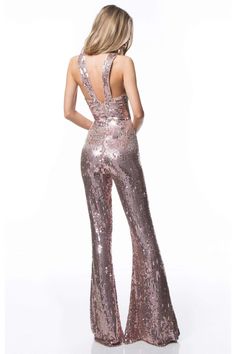 RSparkle like a celebrity in this iridescently rendered Sherri Hill 52082 creation. Crafted with an allover sequined design, this piece shows a halter neckline with crisscrossing panels and a triangular cutout. Fabricated with a low notched back and an empire waist, the ornate silhouette streams and flares into a full-length jumpsuit design. Be at the front and center of the limelight in this Sherri Hill masterpiece. Models are wearing Rose Gold, Light Blue, Light Green and Silver colors. Style: Beaded Jumpsuit, Jumpsuit Design, Disco Bachelorette, 70s Girl, Disco Fashion, Sequin Jumpsuit, Backless Jumpsuit, Designer Jumpsuits, Couture Candy