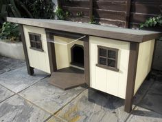 a dog house that is sitting on the ground