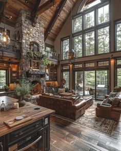 a living room filled with lots of furniture and large windows on the wall next to a fire place