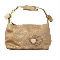 Coach Poppy Lurex Signature Gold Spirit Handbag Purse H1249- F17472 Hearts 15 X 8 X 4.5 Inches Chic Gold Coach Shoulder Bag, Chic Gold Coach Bag, Gold Designer Coach Bag, Designer Coach Gold Bag, Coach Gold Top Handle Bag, Gold Coach Bag With Removable Pouch, Coach Gold Top Handle Shoulder Bag, Gold Coach Shoulder Bag For Shopping, Gold Top Handle Shoulder Bag By Coach