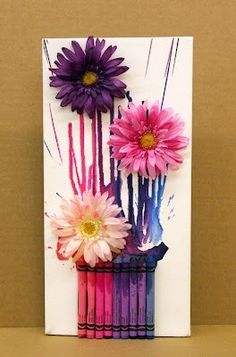 a card with flowers and sticks in it