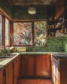 Dark Midcentury Modern kitchen design with dramatic lighting and rich wood tones Bali Style Kitchen Interior Design, Kitchen Eclectic Modern, Retro Kitchen Modern, 70s Style Decor Interior Design, Kitchen Ideas No Window, Retro Style Home Decor, Green And Wooden Kitchen, Green Kitchen With Wood Cabinets, 70s Aesthetic Kitchen