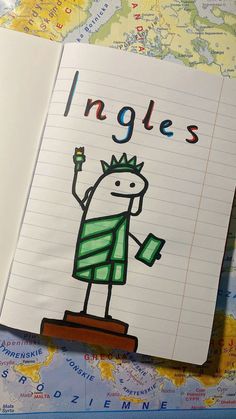 an open notebook with a drawing of a cartoon character on it and the words ingles written in large letters