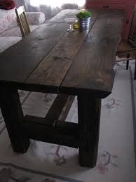 a wooden table sitting in the middle of a living room