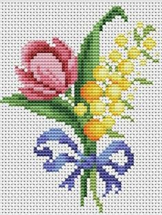 a cross stitch pattern with flowers and butterflies on the front, which reads armida ferreta