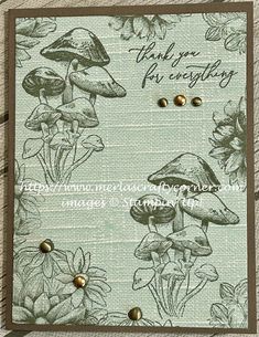 a card with mushrooms and flowers on it