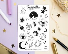 an assortment of stickers with stars, moon and planets on them next to some crayon pens