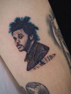 a tattoo on the leg of a person with an image of a man