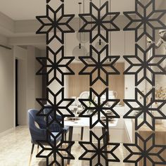 the room divider is designed to look like an intricate design, with geometric shapes on it