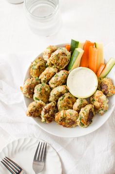 a white plate topped with meat and veggies