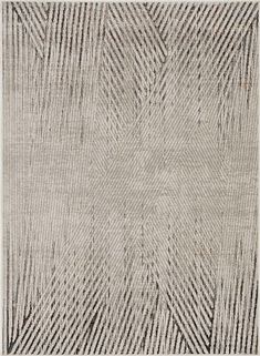 an area rug with lines in grey and white colors on the ground, including one diagonal pattern